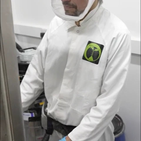 Technician blending custom formulas